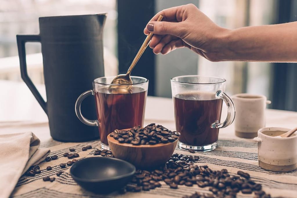 Barista Pours Water From Coffee Pot